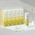 Atomy Propolis Toothpaste set de 5 cajas en baño con cepillo amarillo